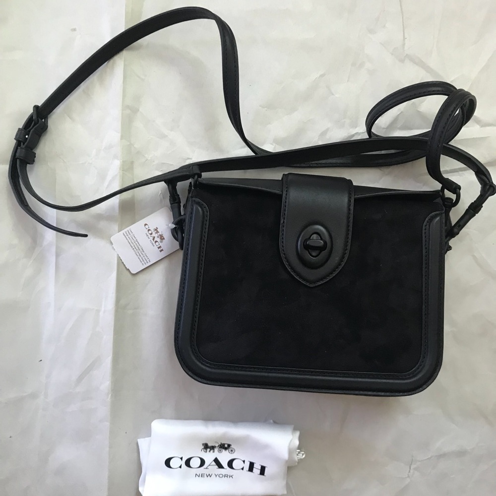 Coach crossbody leather bag with turnlock opening
